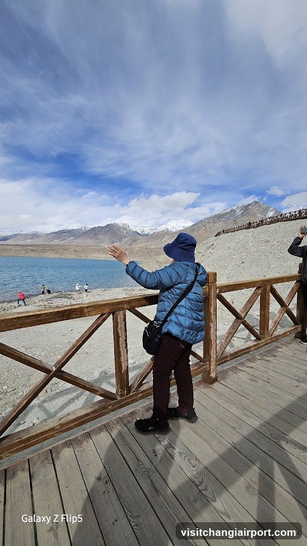 Visitor at a scenic lake viewpoint
