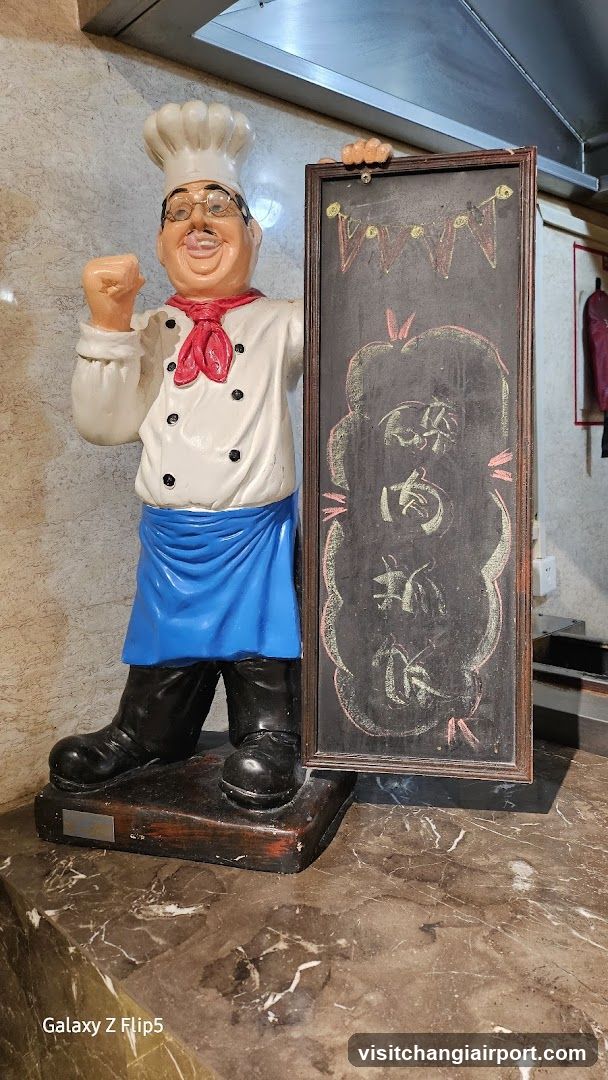 Chef Statue with Chalkboard Sign