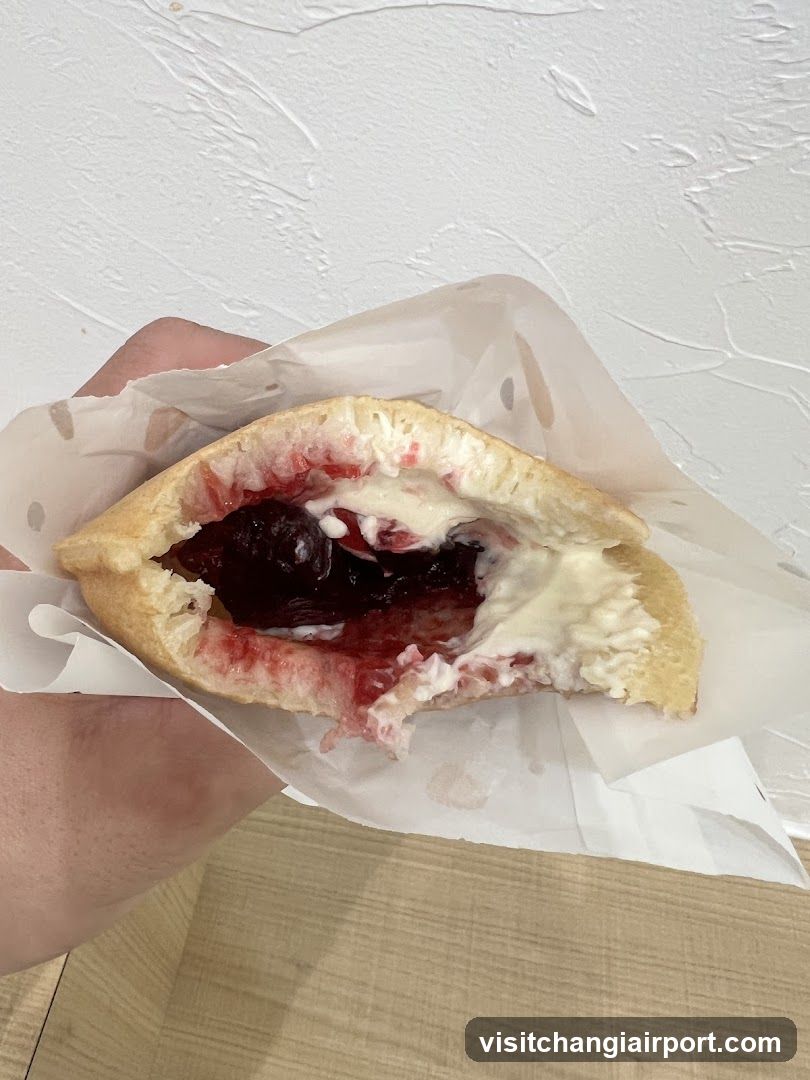 Handheld Pastry with Cream and Jam