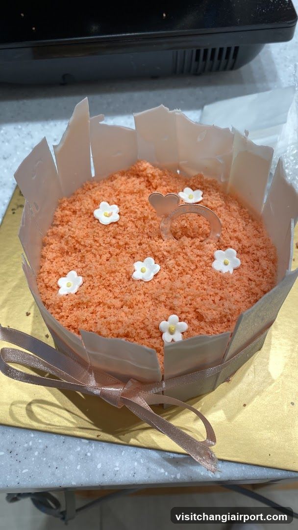Orange Cake with White Flowers