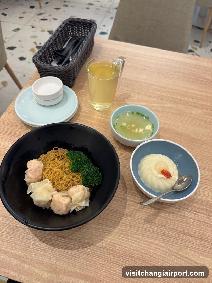 Dining Table with Noodles and Side Dishes