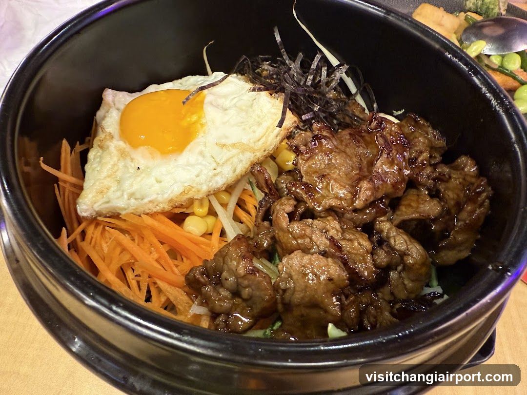 Bowl of Korean-style beef rice with egg and vegetables
