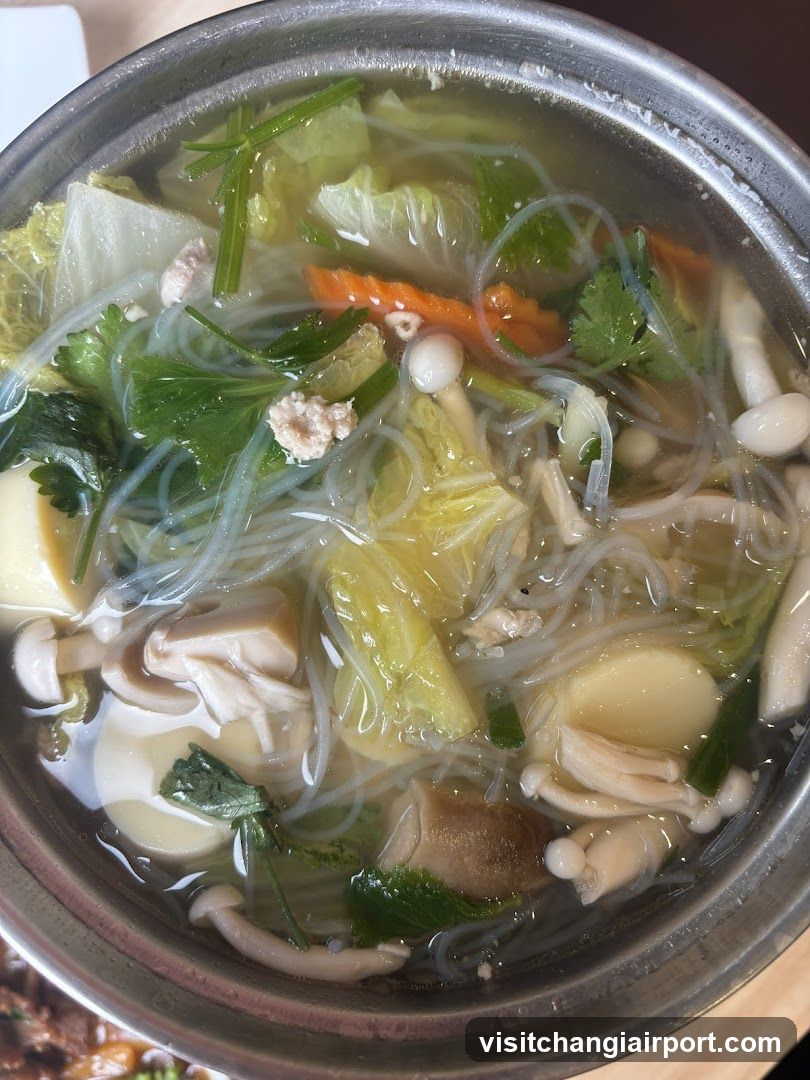 Bowl of Noodle Soup with Vegetables and Mushrooms