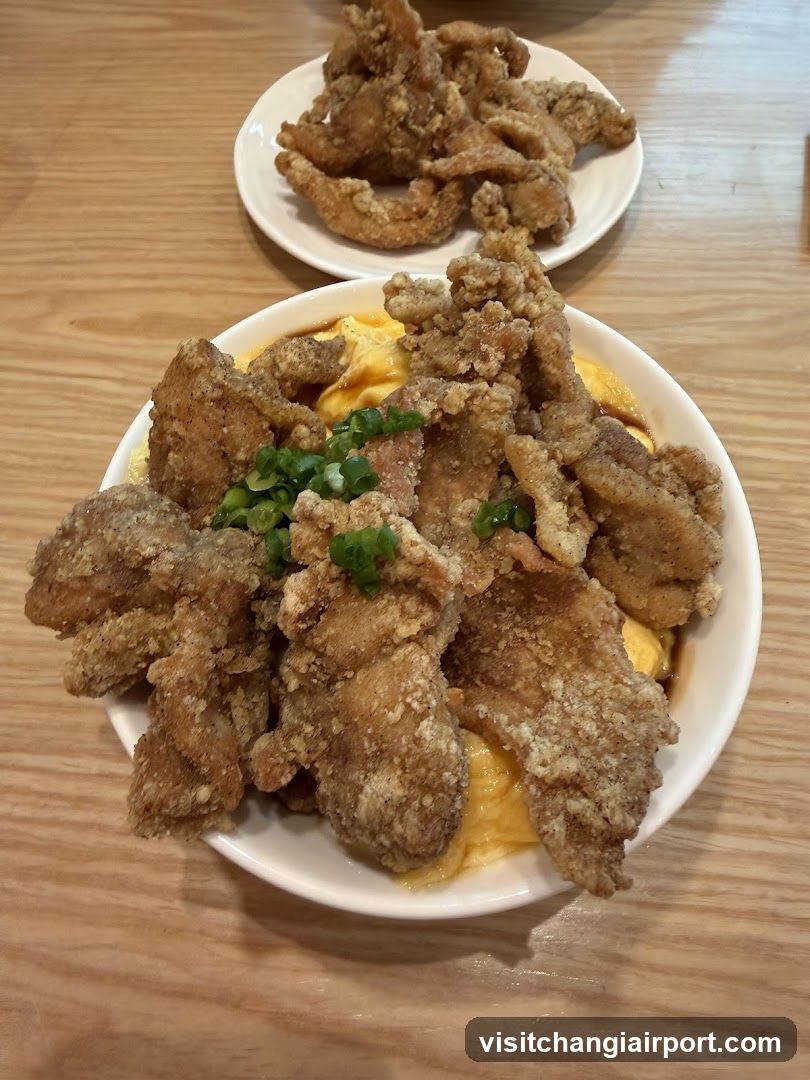 Fried Chicken Dish with Sauce and Garnish