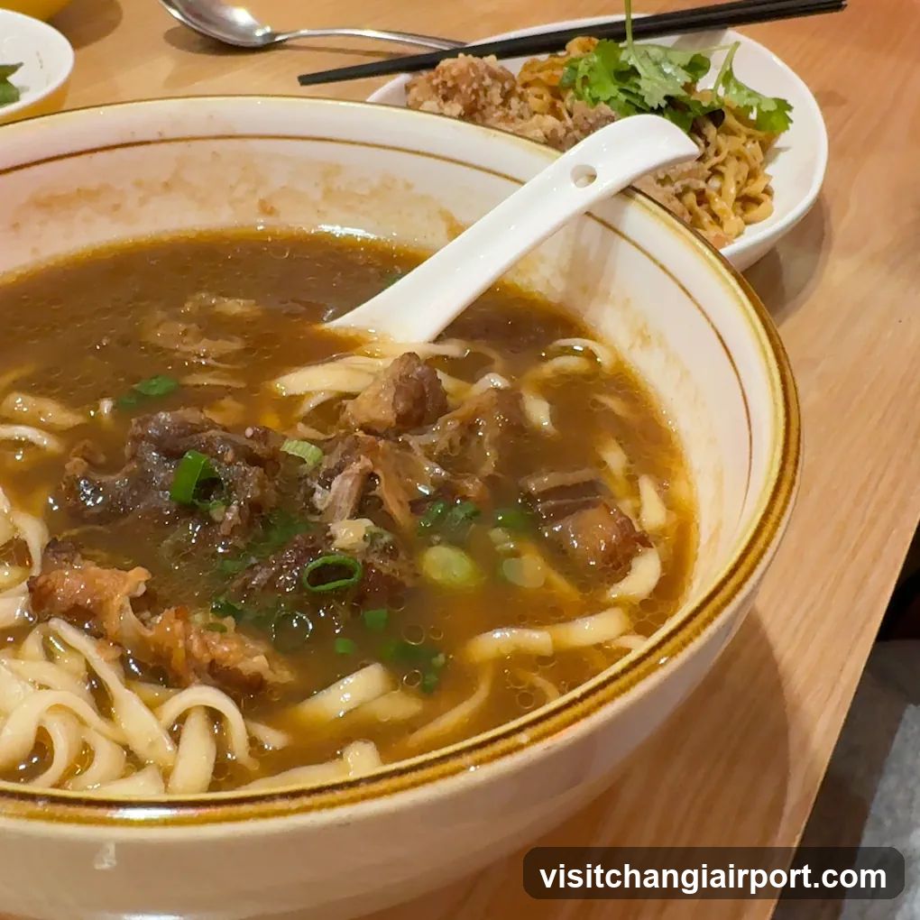 Bowl of Noodle Soup with Meat and Greens