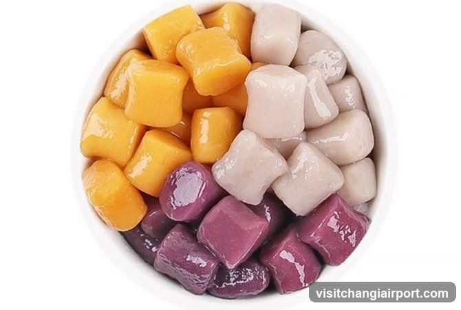Bowl of colorful tapioca pearls and mango cubes