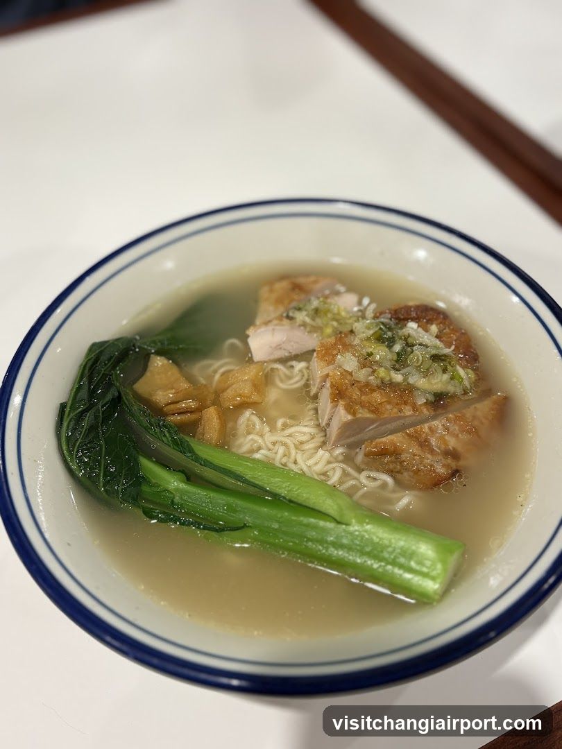 Bowl of Noodle Soup with Chicken and Greens