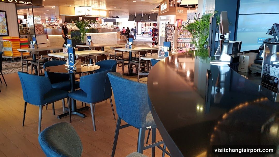 Restaurant Interior with Blue Chairs and Bar Counter