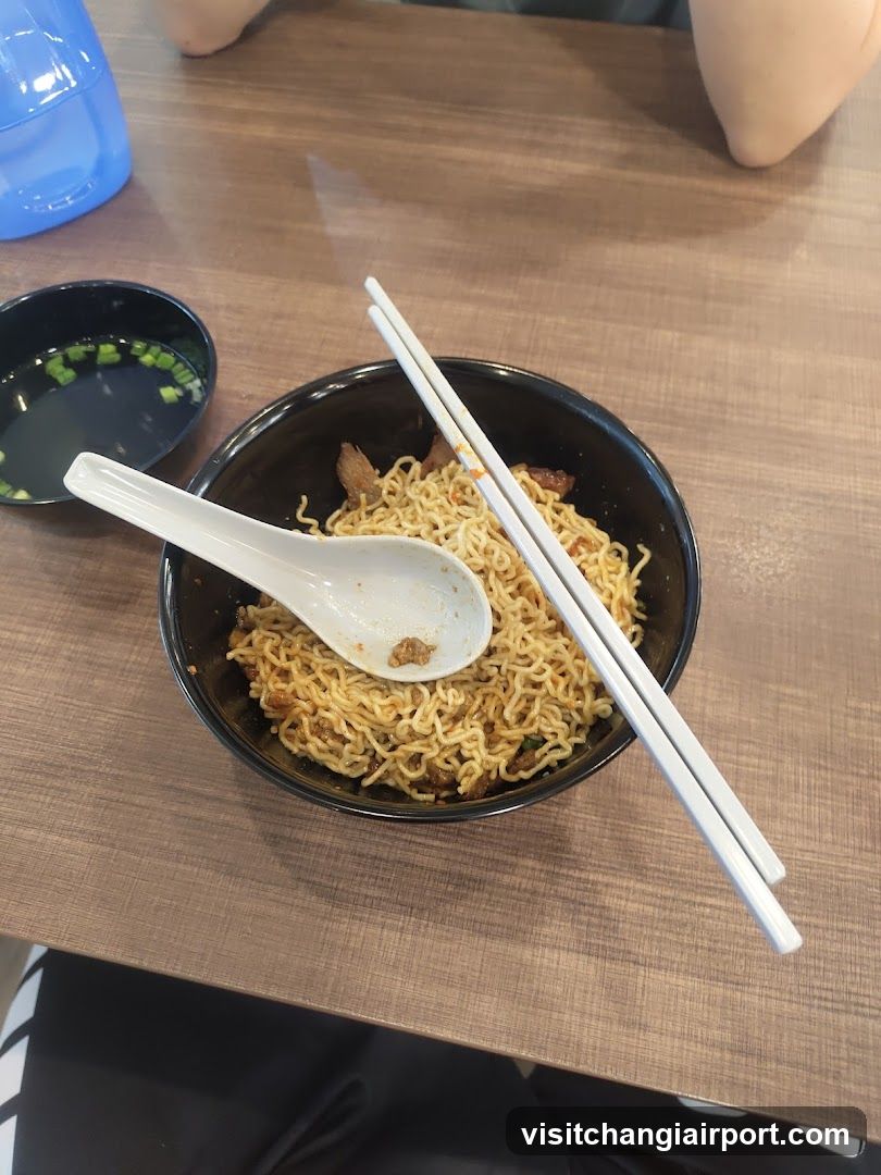 Noodle Bowl with Chopsticks and Spoon